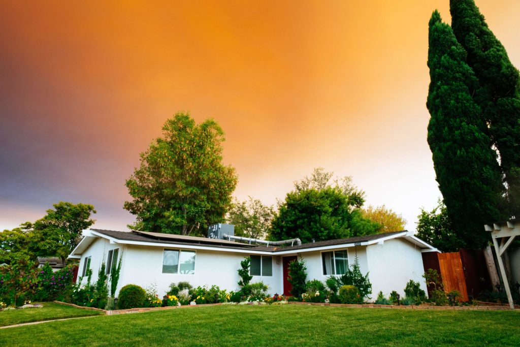 home with a golden sunset in the background