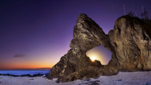 unique rock formation with purple sky