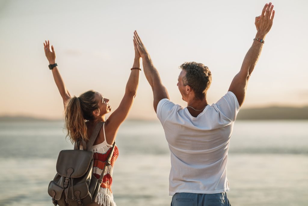 Couple enjoying beach because of her swoosh finance weekend loan