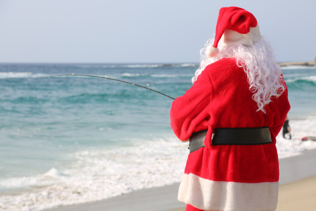 father christmas fishing in the sea | Swoosh Finance 