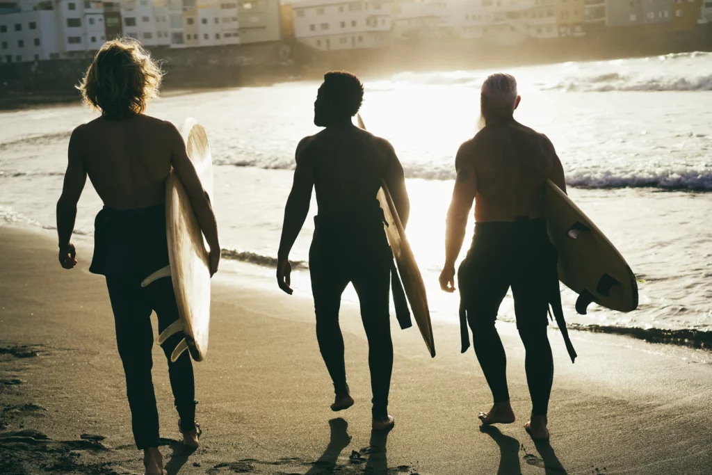 Learn to surf with friends on a weekend away | Swoosh Finance