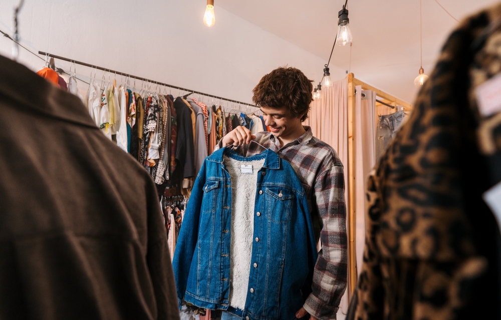 A young man thrifting for the best finds while on a date