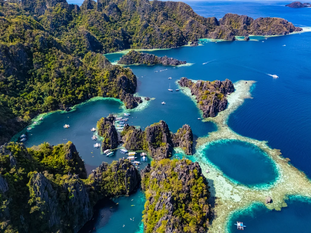 Aerial view of islands and boats in Palawan, Philippines