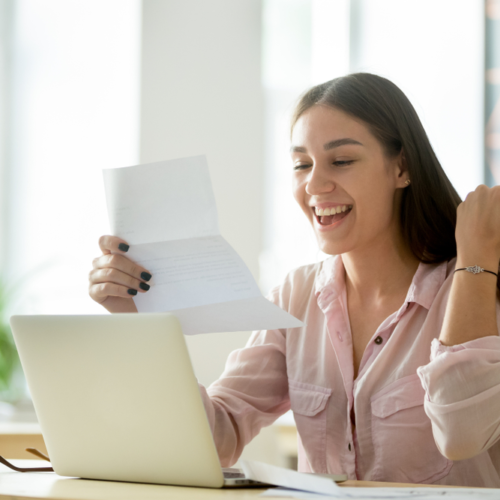 A girl celebrating because she was just approved for a loan | Swoosh Finance