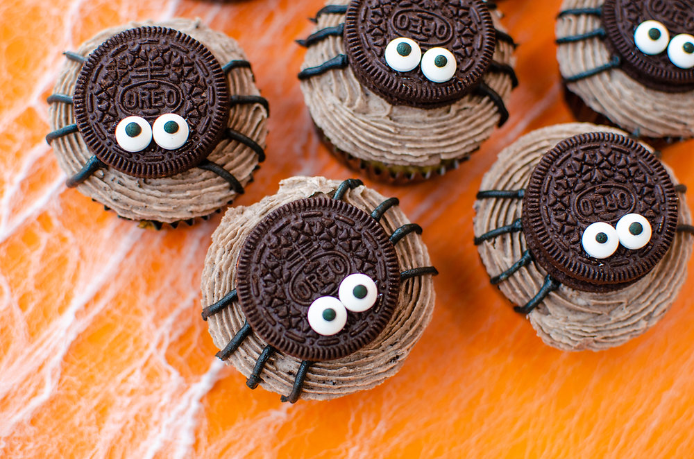 Oreos on top of a cupcake with icing stripes to create legs to make it look like a spider.