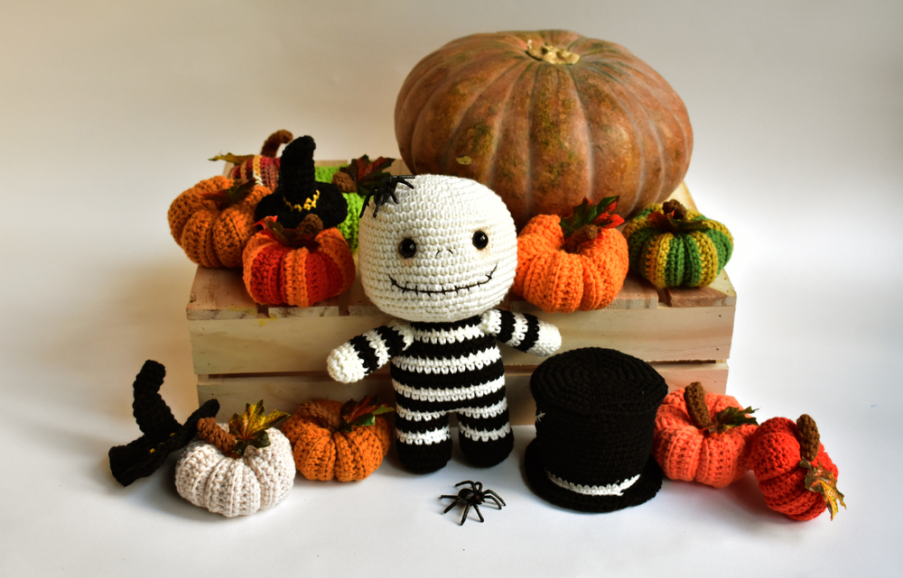 Halloween inspired crochet creations including witches hats, pumpkins and a skeleton.