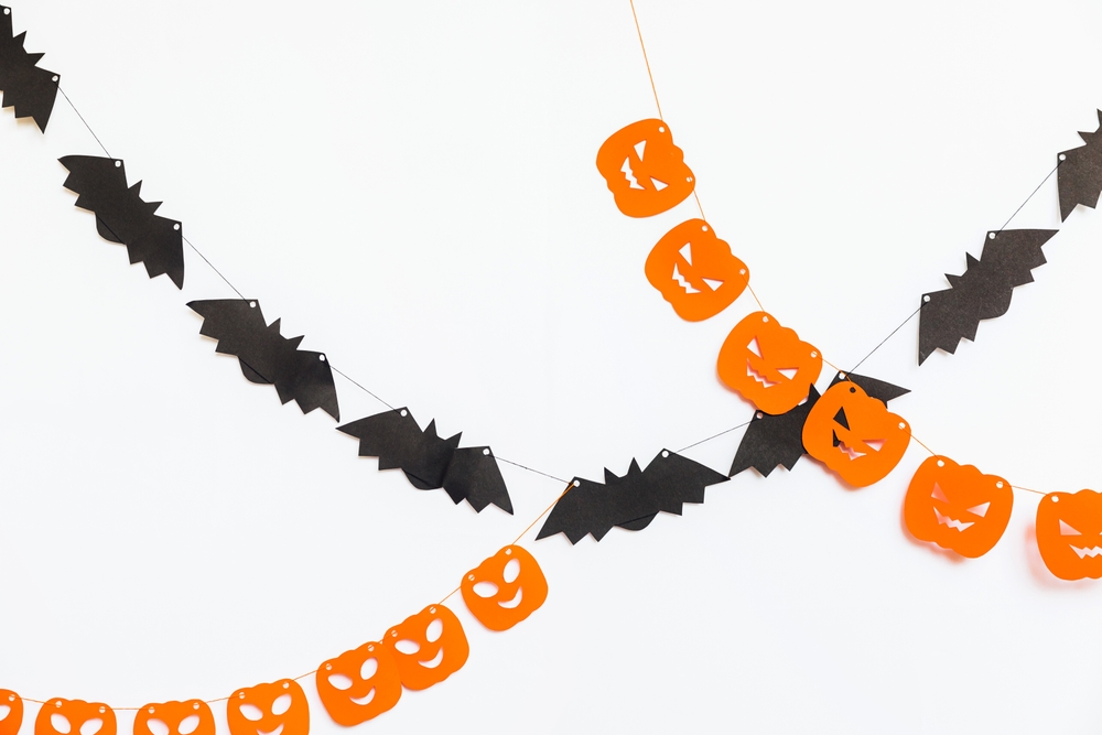 Halloween shaped paper garlands, shapped like bats and pumpkins.