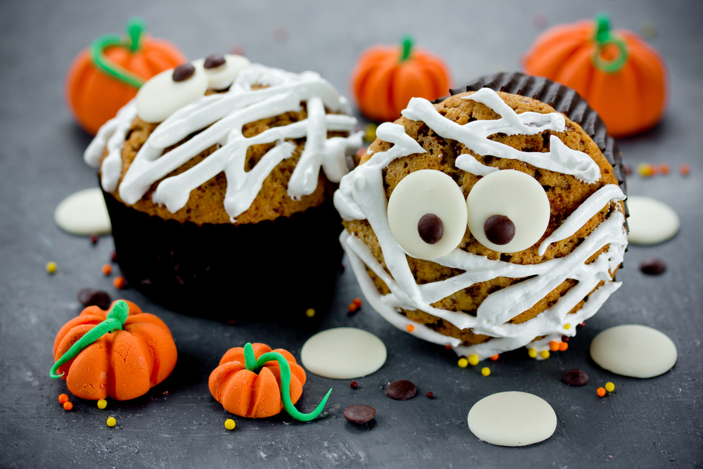 Cupcakes with stripped white icing to create mummy monsters.