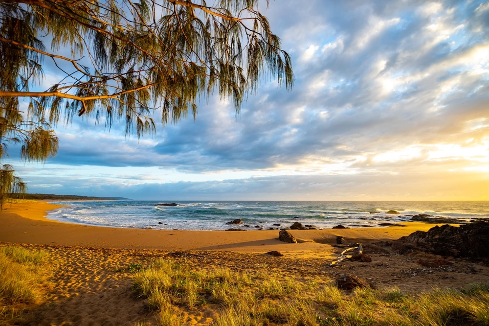 Sunset of empty Agnes Waters Beach for a quiet and peaceful New Year's| Swoosh Finance