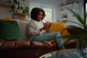 Woman applying for consolidation loan with bad credit on mobile phone
