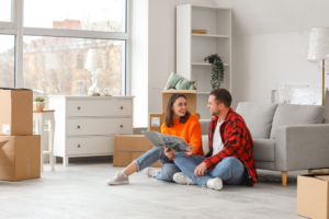 Young couple deciding how to decorate their home on a budget