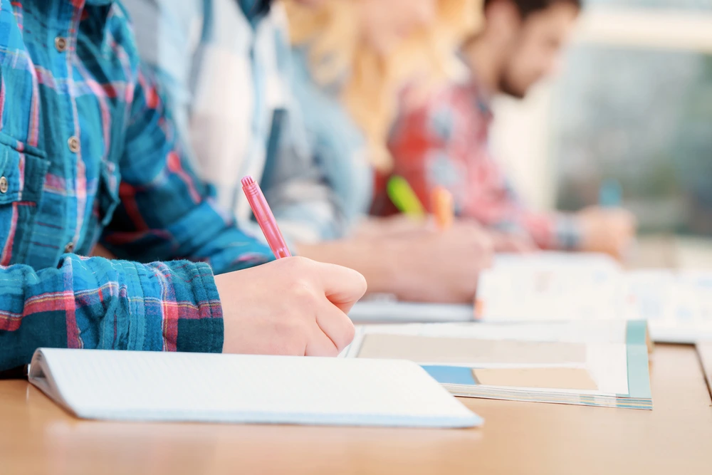 Students having an in person exam | Swoosh Finance