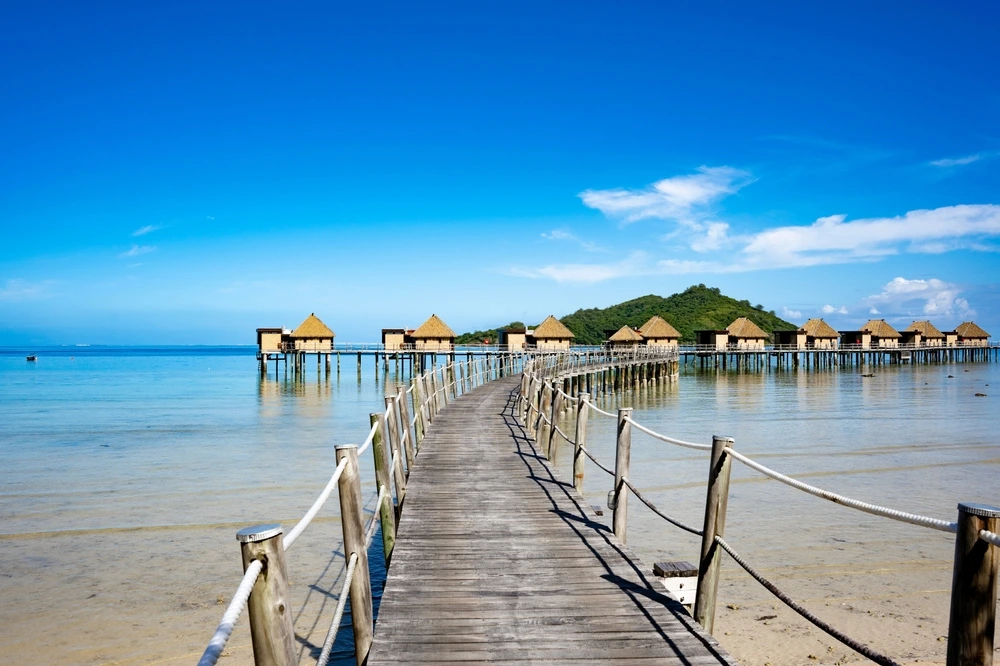 Coast of Fiji with huts over water