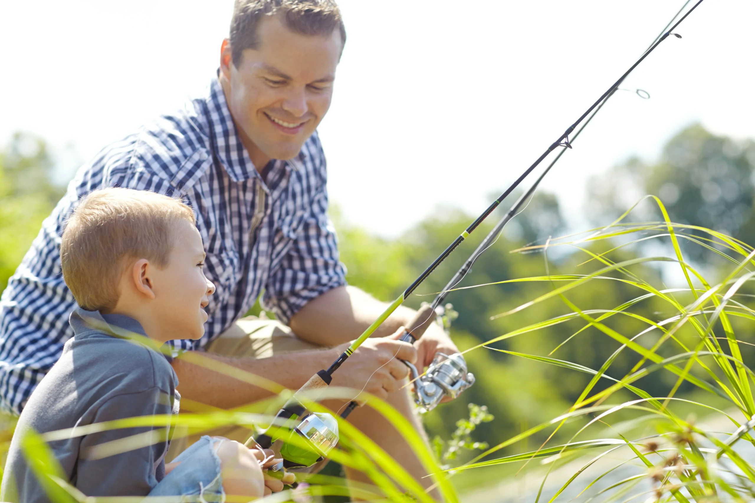 A father and son fishing together