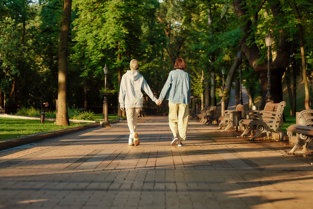 Couple walking in the park in a new city