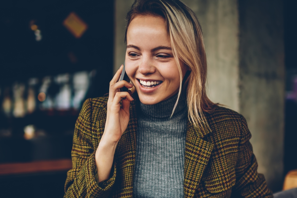 Happy lady arranging to get a personal loan to improve her credit score | Swoosh Finance