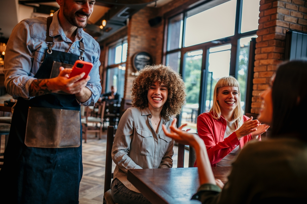 Man taking second income as waiter | Swoosh Finance