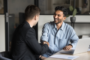 Men shaking hands after imrpoving credit ratings