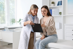 Doctor and Patient looking over medical bill