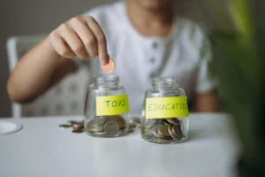 you can teach kids about money using a clear jar