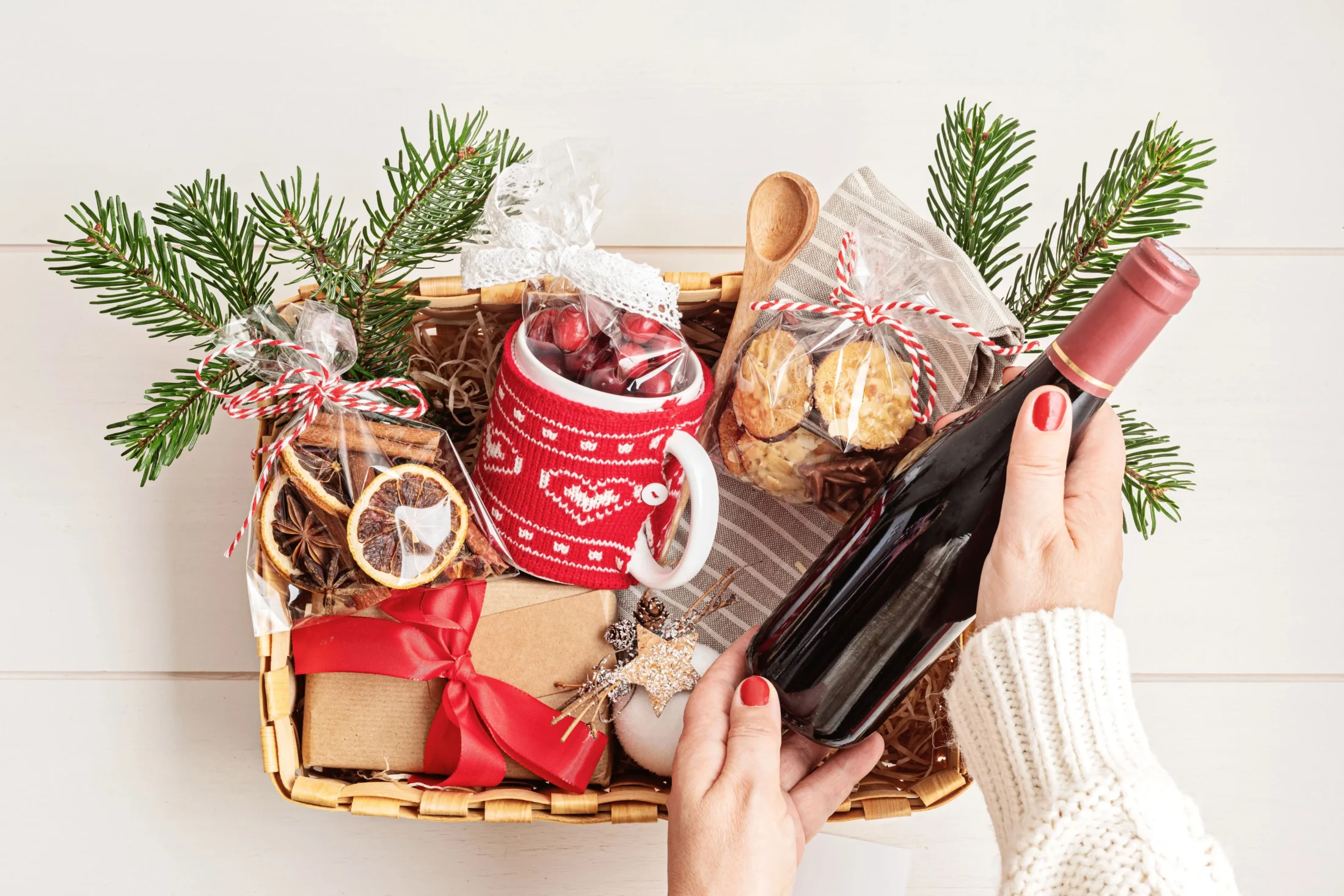woman assembling DIY christmas hamper