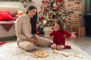 Mum and Daughter playing blocks on Christmas morning