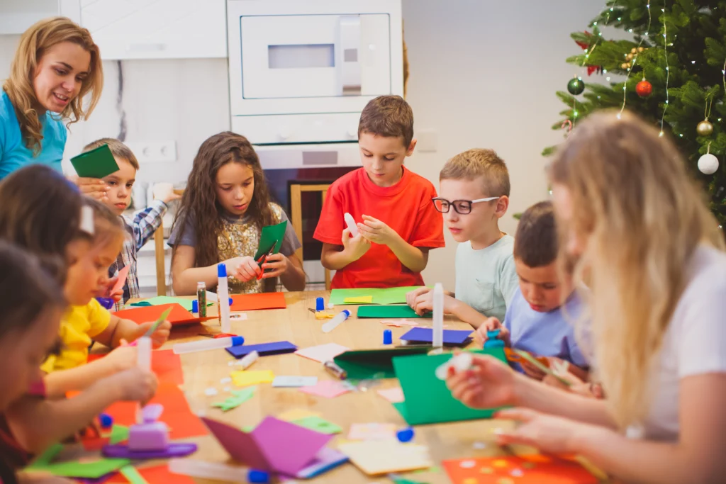 Children taking part in a colourful arts and crafts activity with teachers for R U OK Day